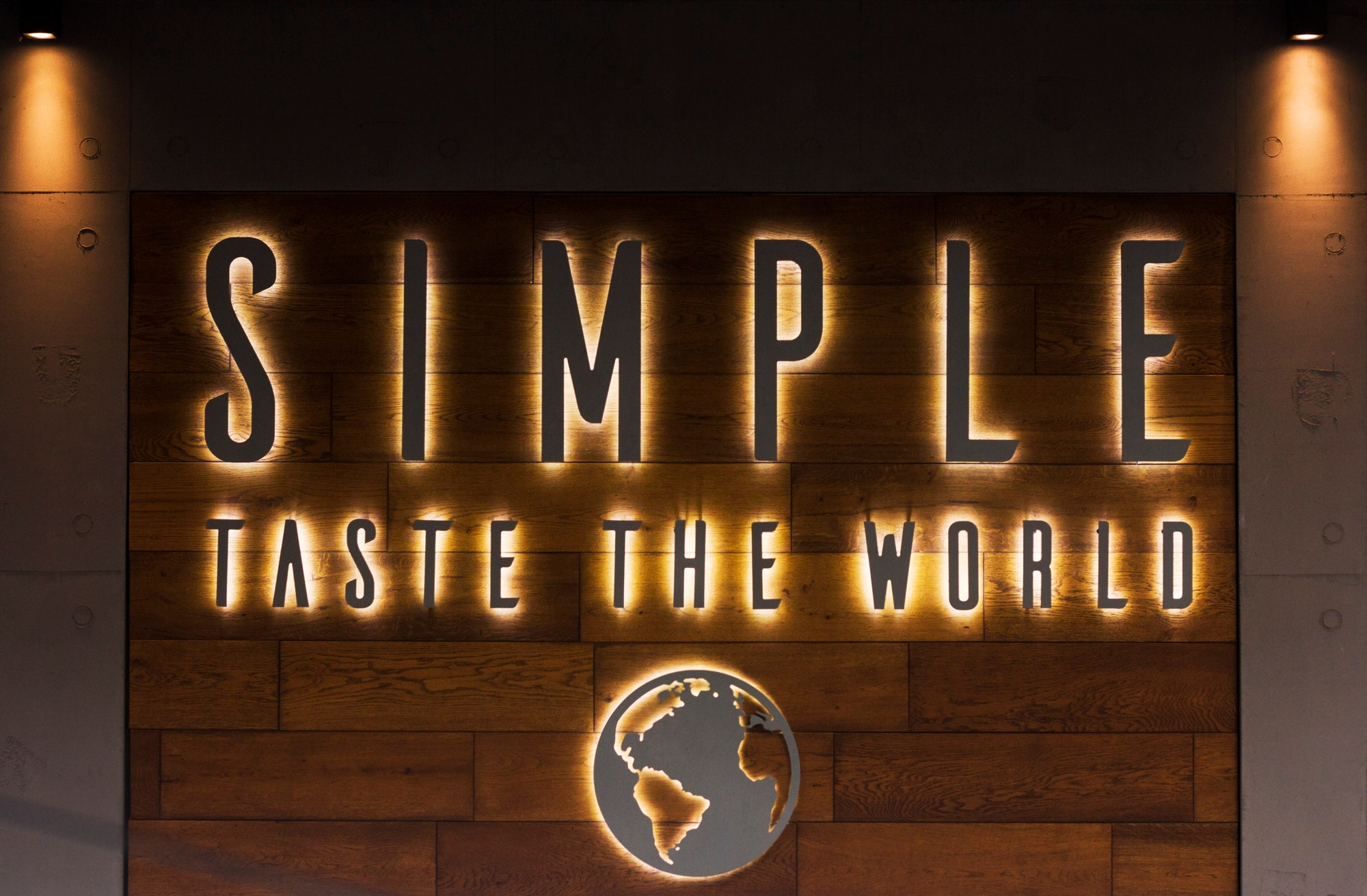 Words in light on the wall of the restaurant, exterior